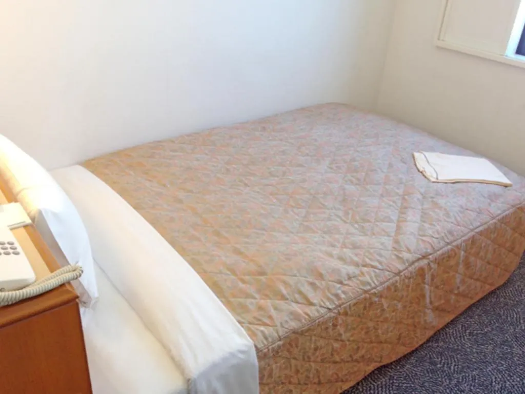 Bed in Kawasaki Green Plaza Hotel