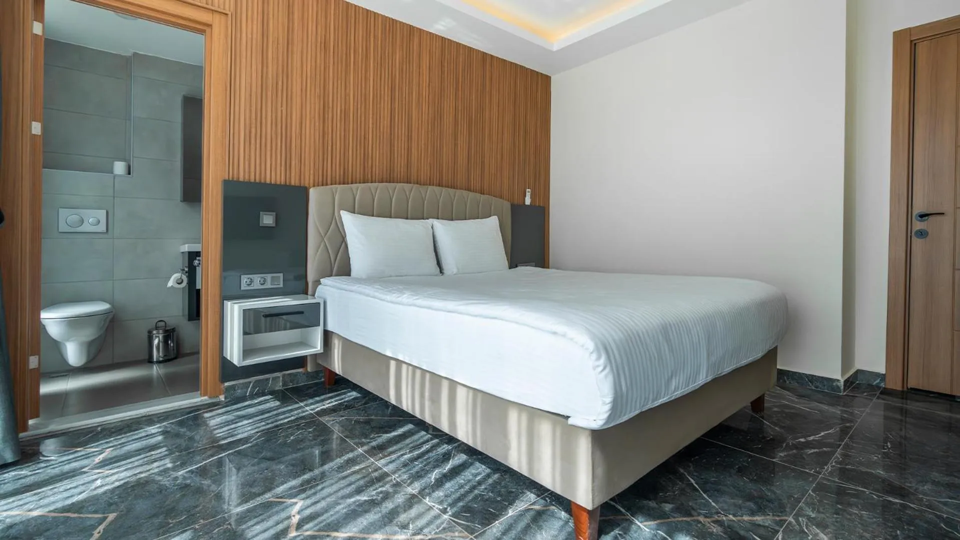 Bed in Evin Park Suit Lara & Spa