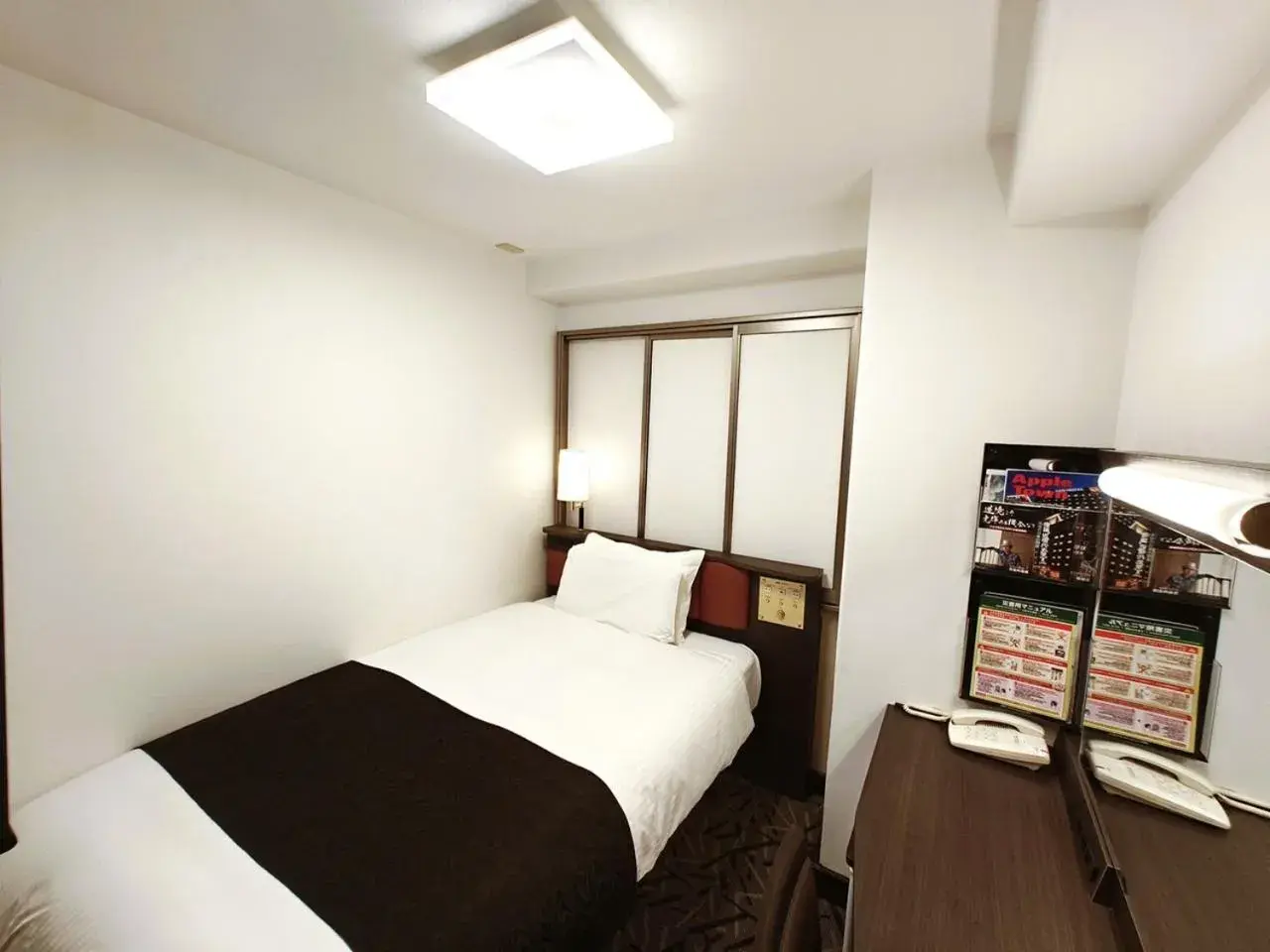 Bed in APA Hotel Tokushima Ekimae Bed in APA Hotel Tokushima Ekimae