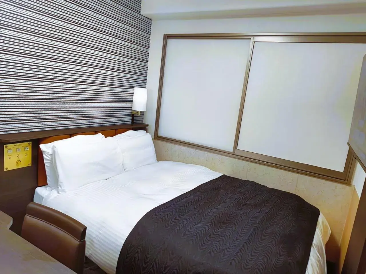 Bed in APA Hotel Tokushima Ekimae Bed in APA Hotel Tokushima Ekimae