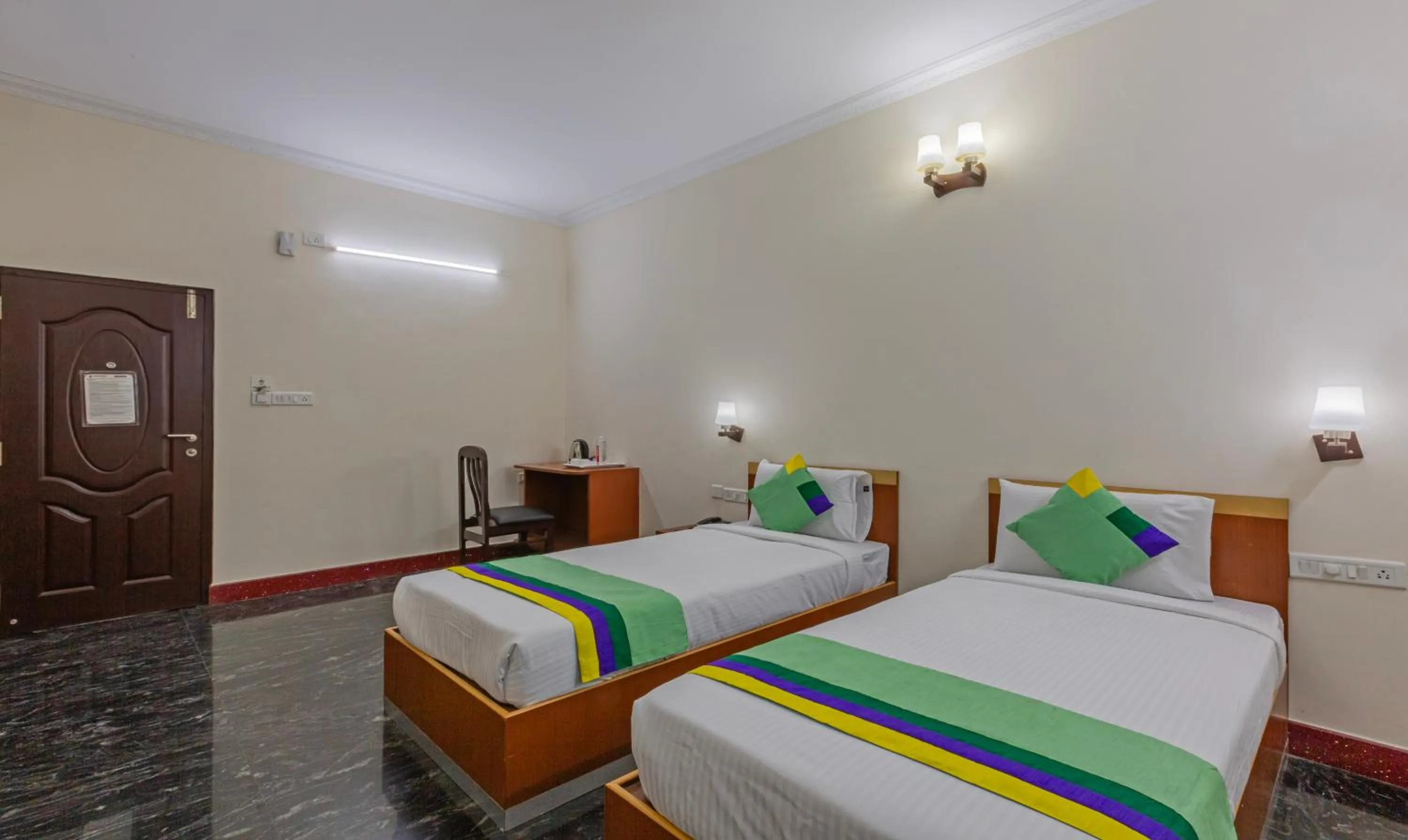 Bed in Treebo Akshaya Residency