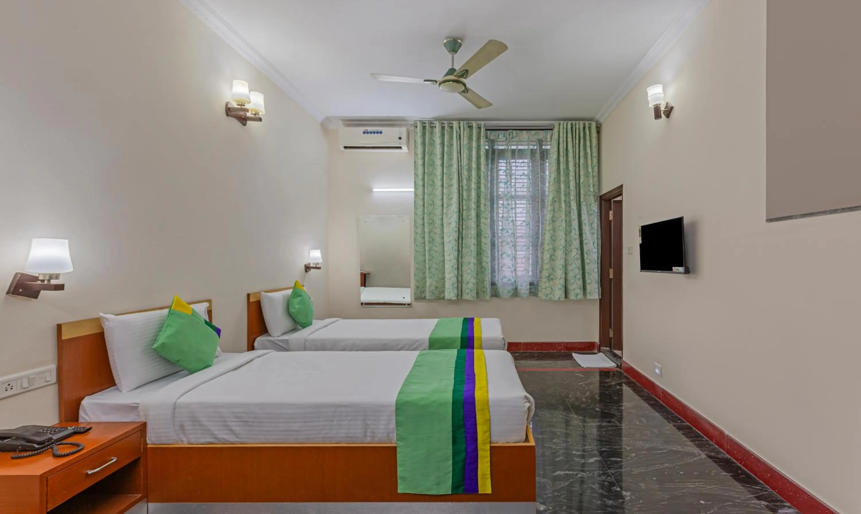 Bed in Treebo Akshaya Residency