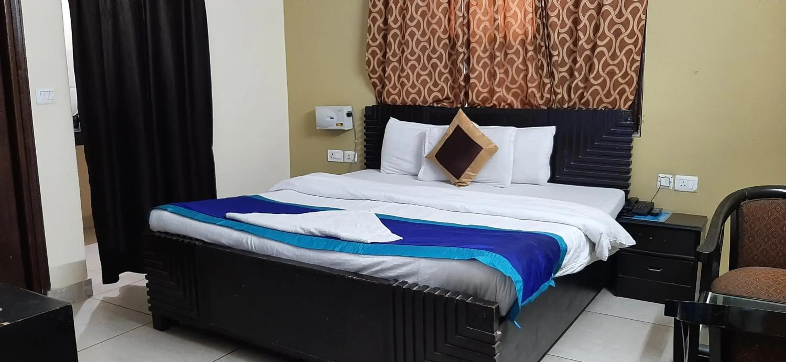 Bed in Hotel Kundan Palace