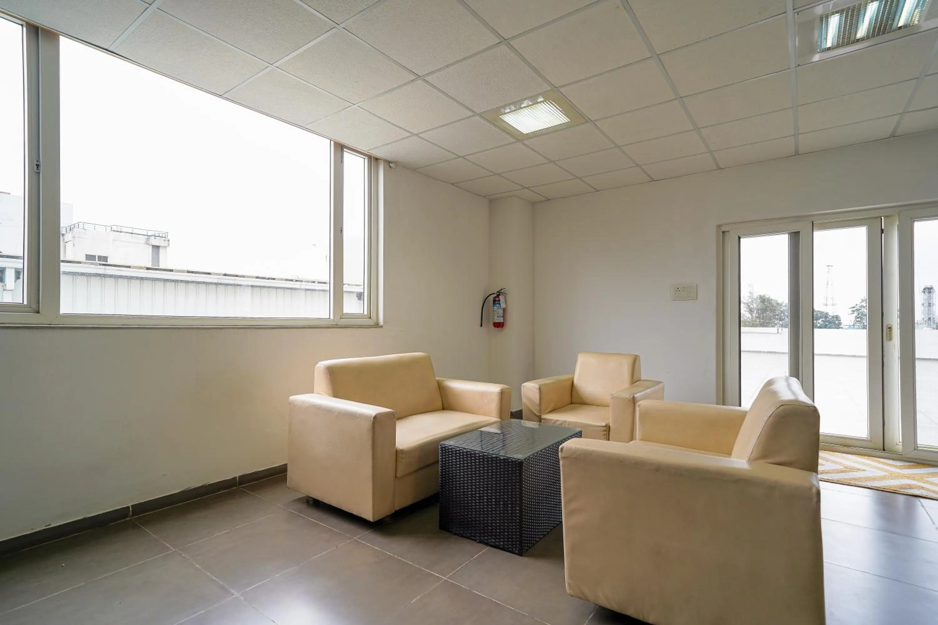 Seating area in Olive Hotel Electronic City by Embassy Group