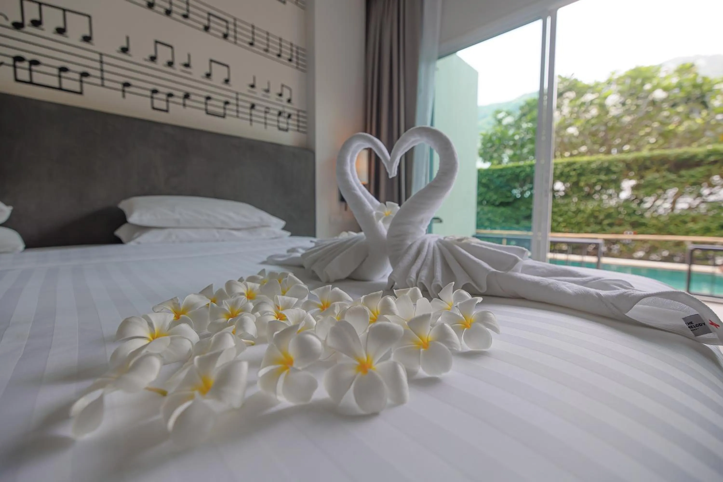 Bed in The Melody Phuket - SHA Extra Plus