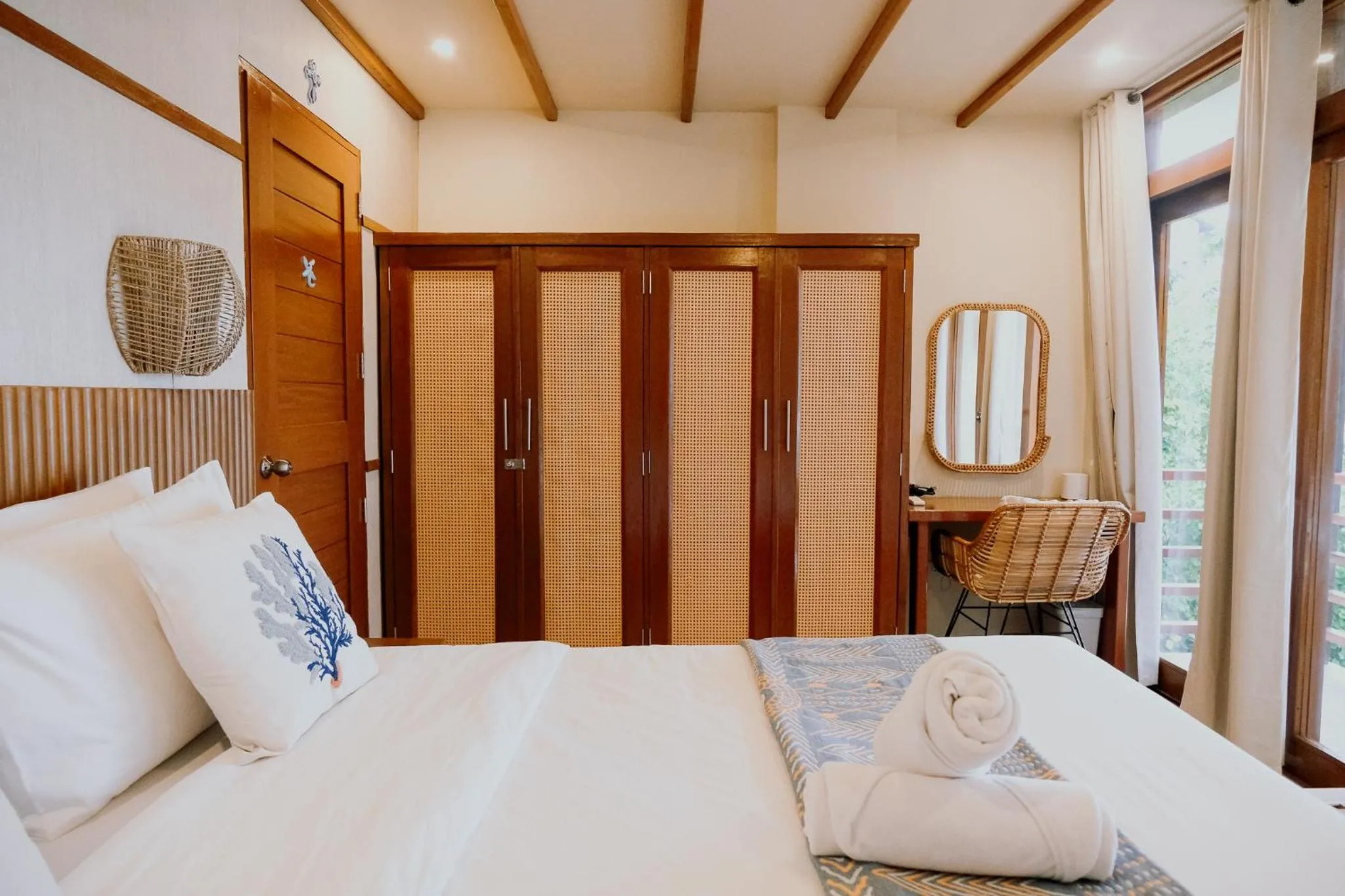 Bed in Katig Beachfront Boutique Hotel