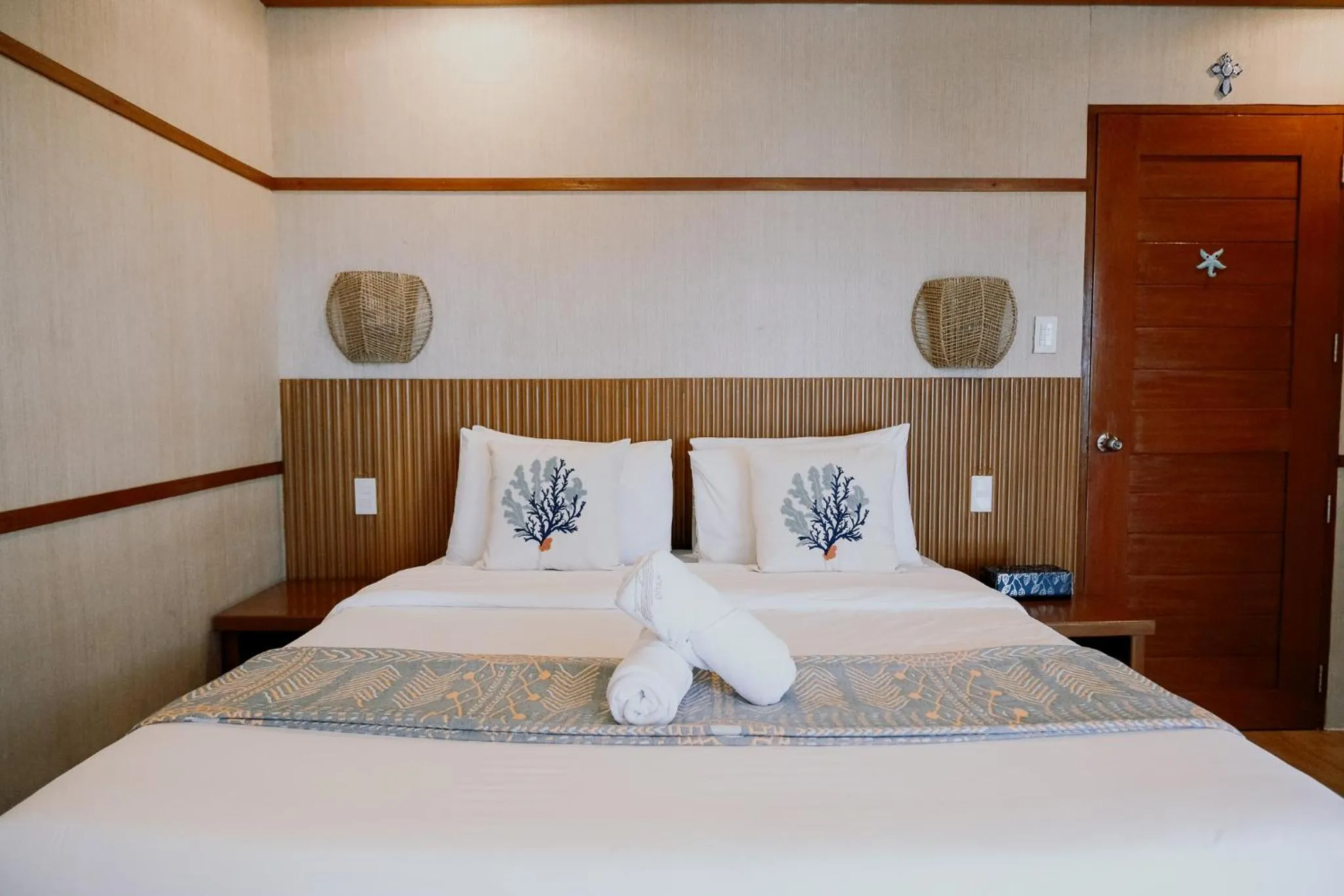 Bed in Katig Beachfront Boutique Hotel