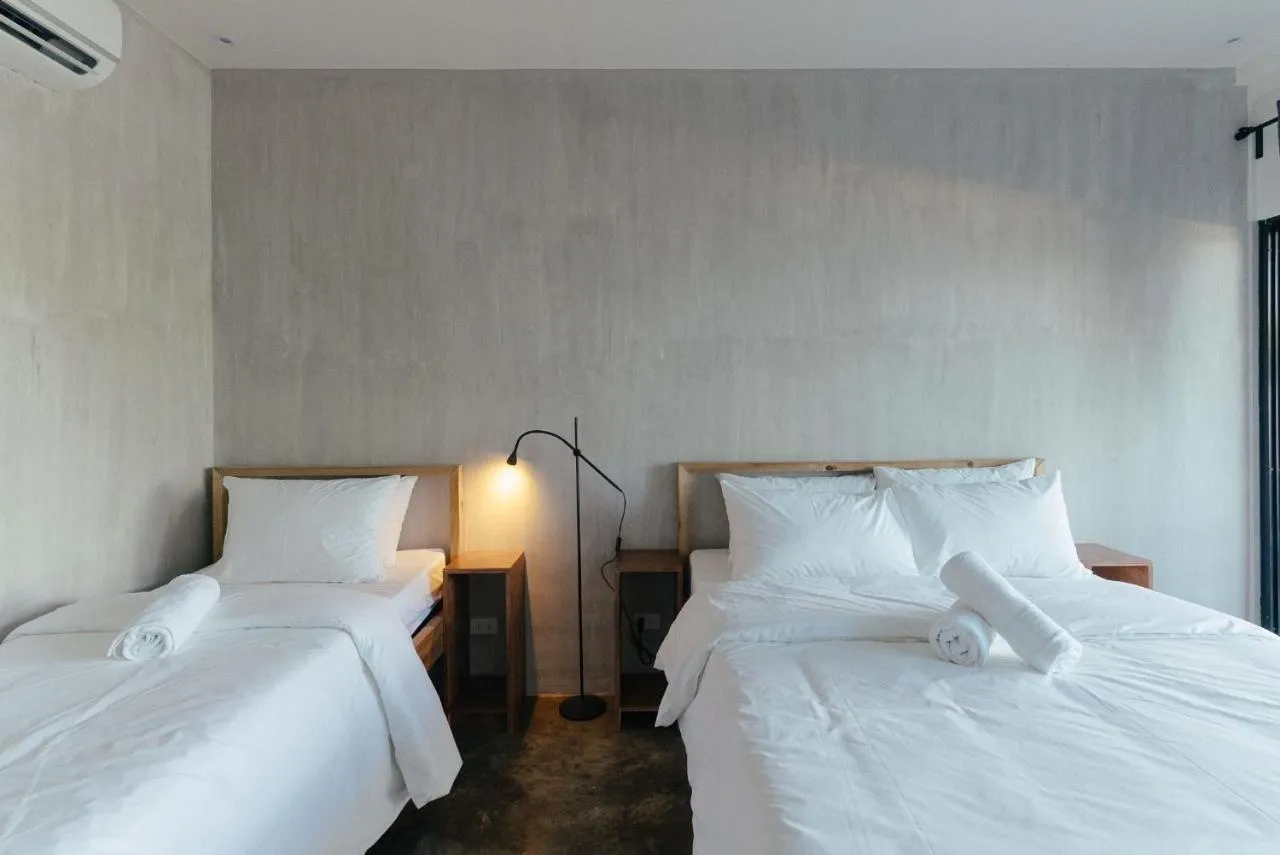 Bed in Katig Beachfront Boutique Hotel