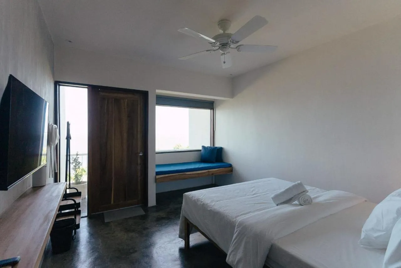 Bed in Katig Beachfront Boutique Hotel