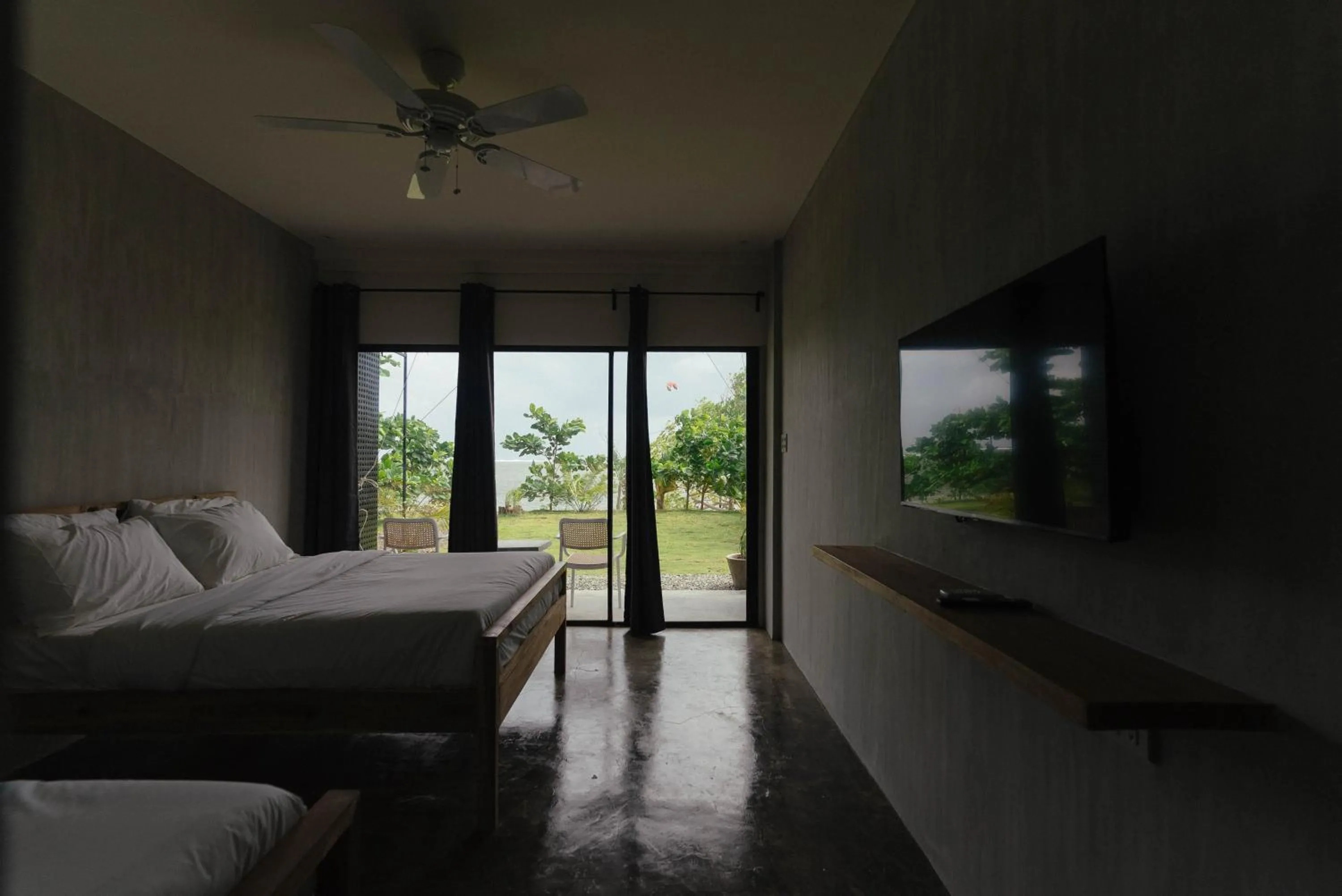 Bed in Katig Beachfront Boutique Hotel