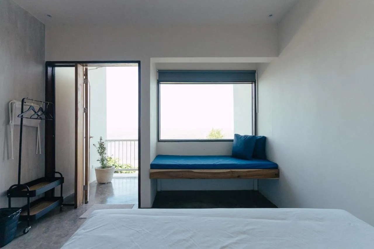 Bed in Katig Beachfront Boutique Hotel