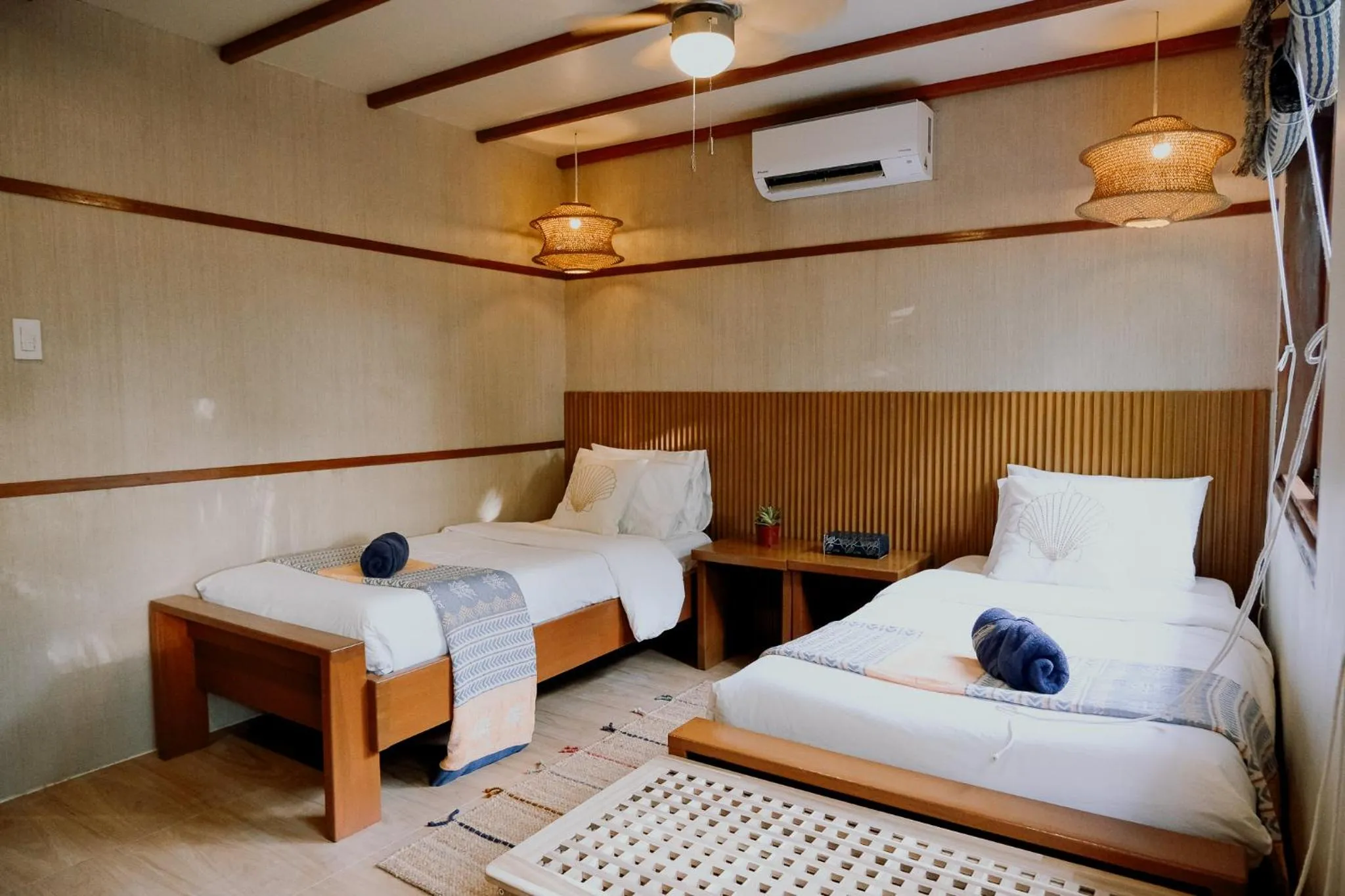Bed in Katig Beachfront Boutique Hotel