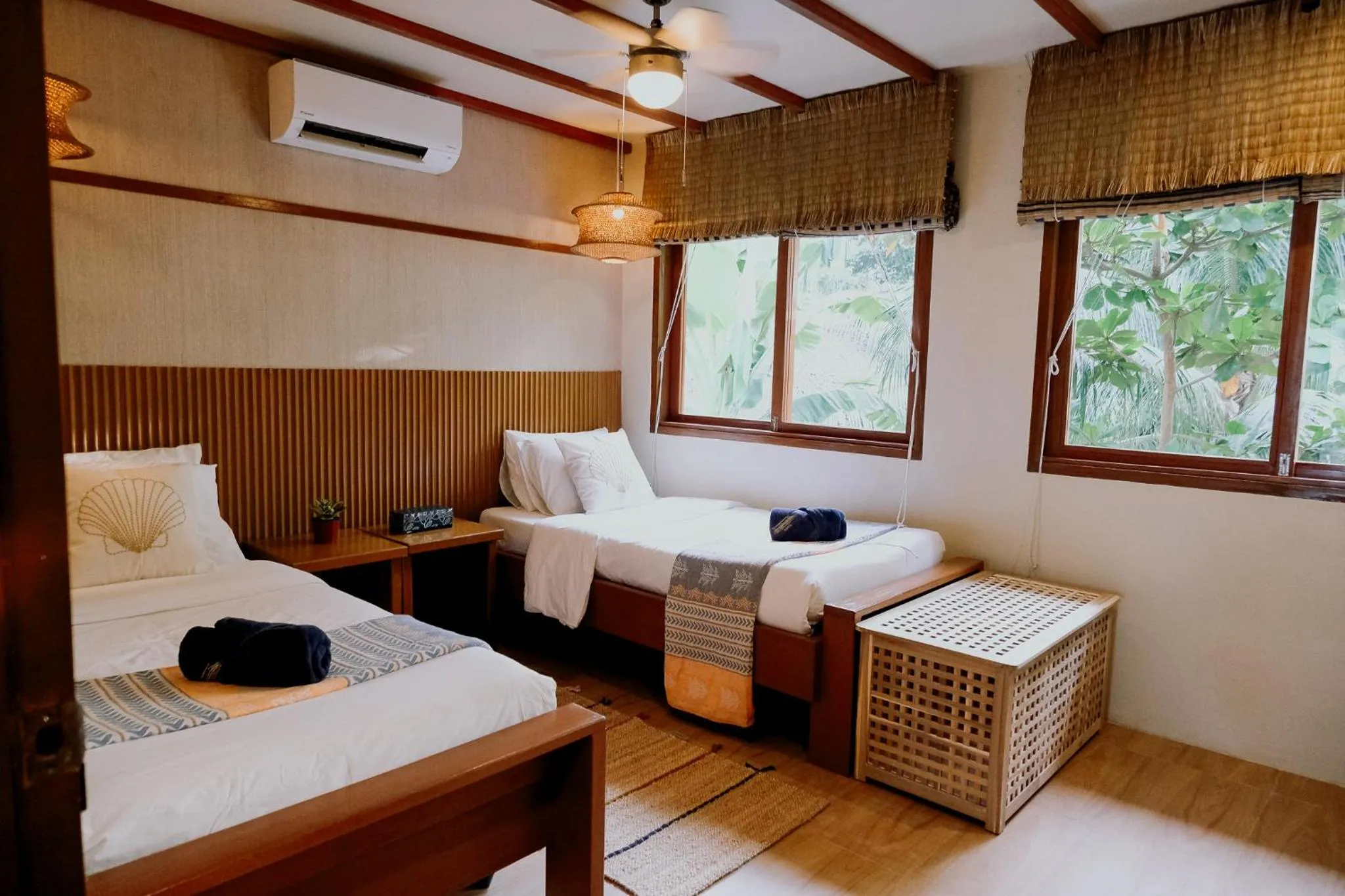 Bed in Katig Beachfront Boutique Hotel