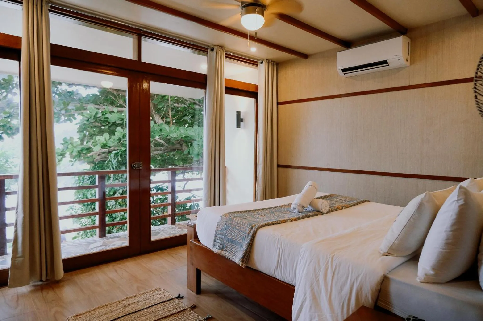Bed in Katig Beachfront Boutique Hotel