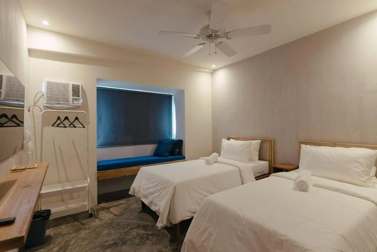 Bed in Katig Beachfront Boutique Hotel