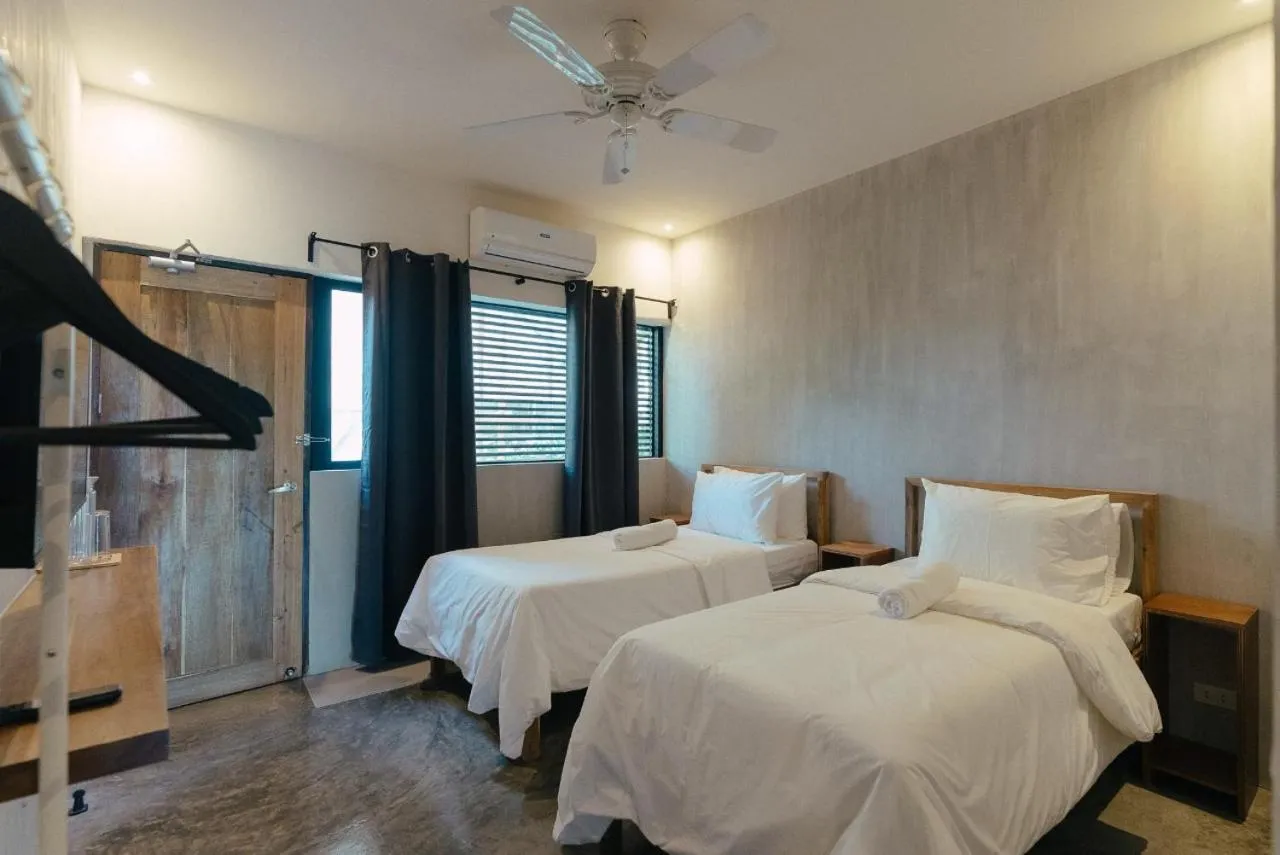 Bed in Katig Beachfront Boutique Hotel
