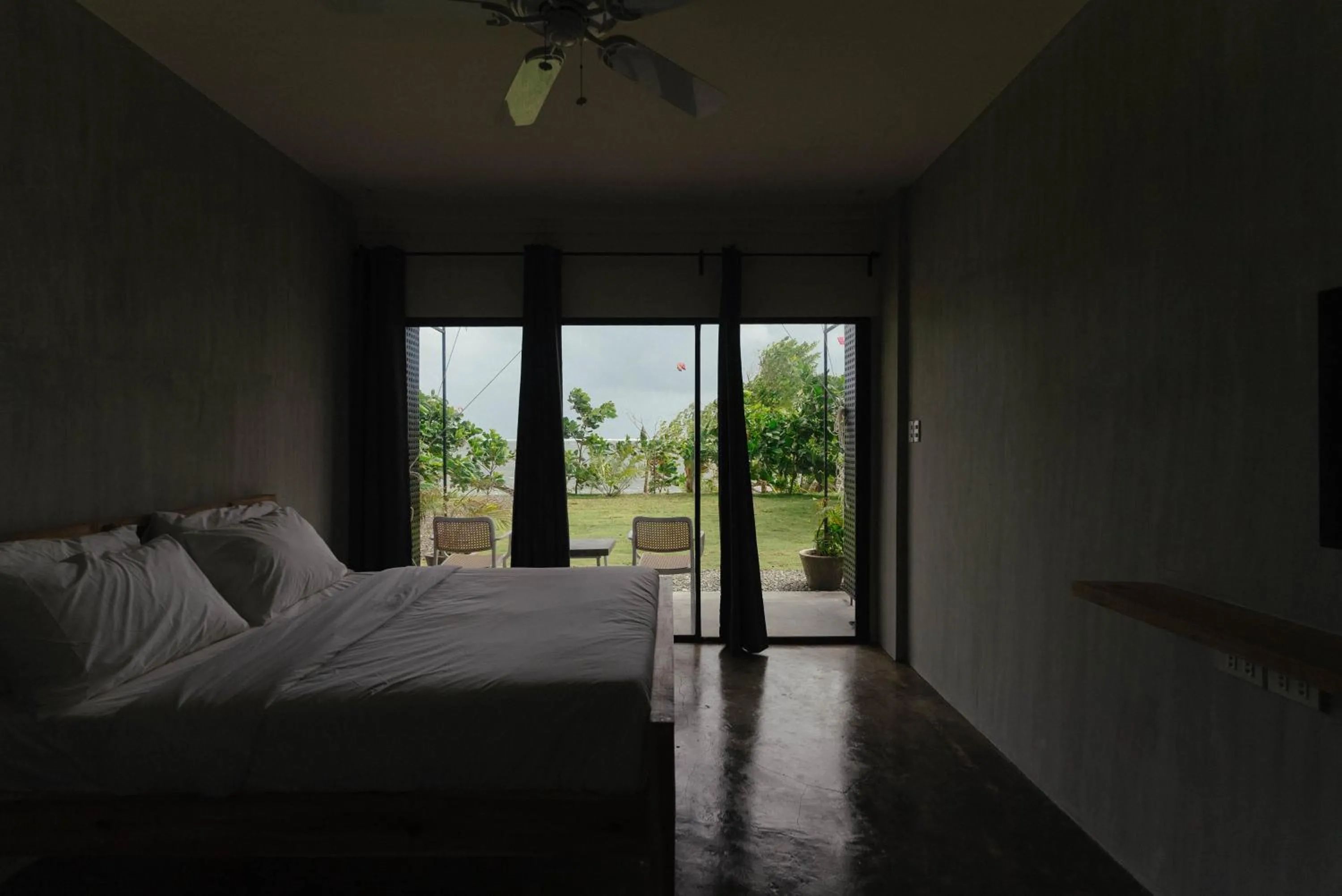 Bed in Katig Beachfront Boutique Hotel