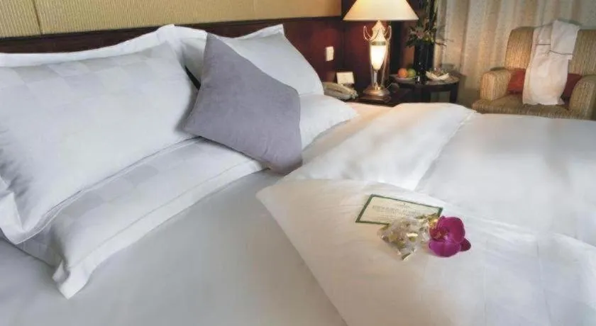 Bed in Shangyu International Hotel