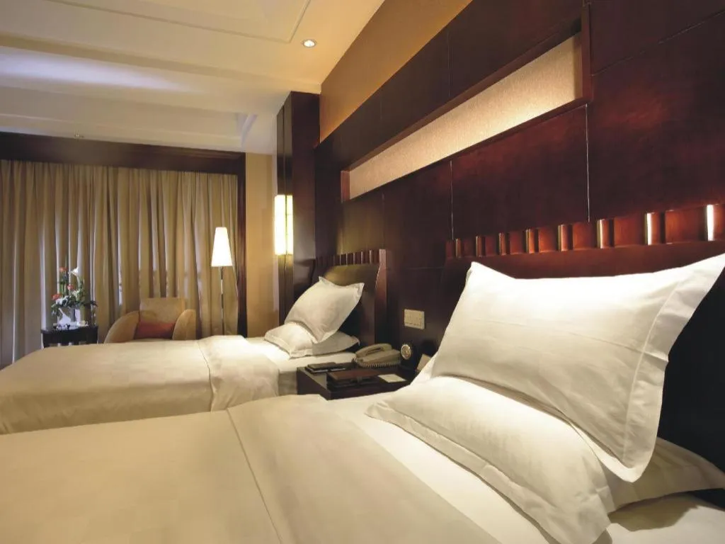 Bed in Shangyu International Hotel