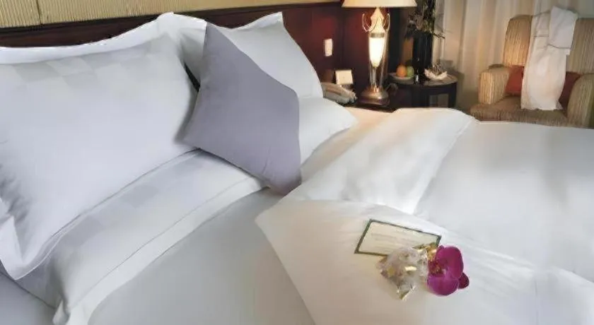 Bed in Shangyu International Hotel