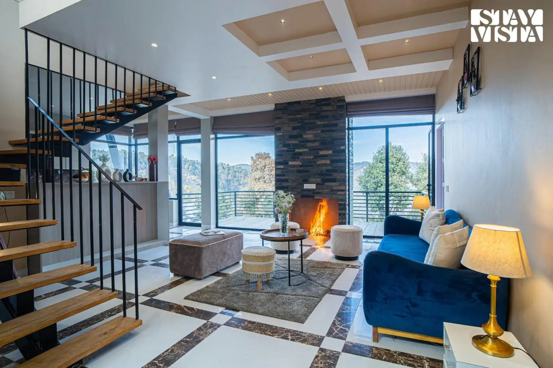 Living room in StayVista at Mountain Melody with Heater & Indoor-Outdoor Games Living room in StayVista at Mountain Melody with Heater & Indoor-Outdoor Games