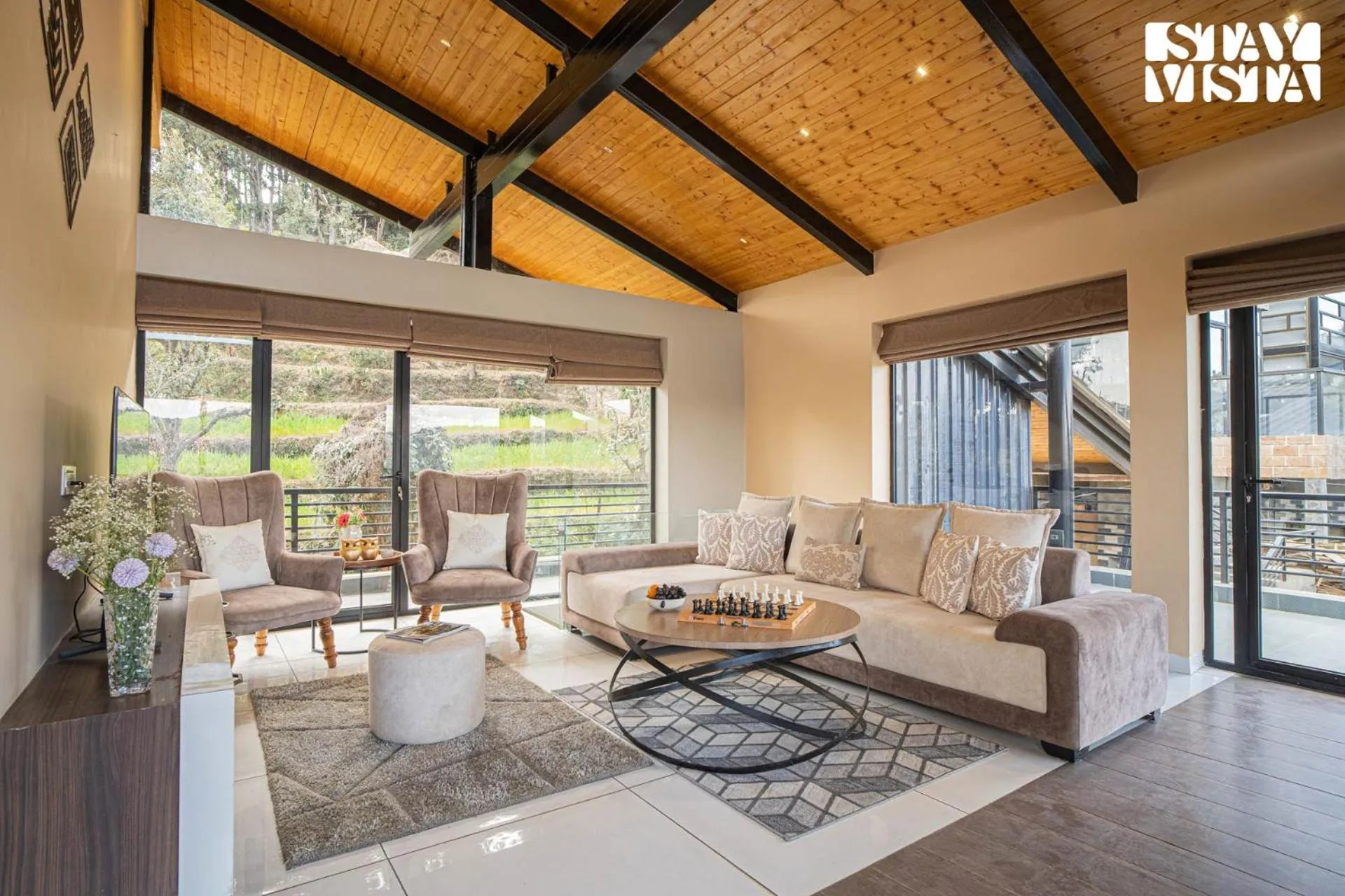 Living room in StayVista at Mountain Melody with Heater & Indoor-Outdoor Games