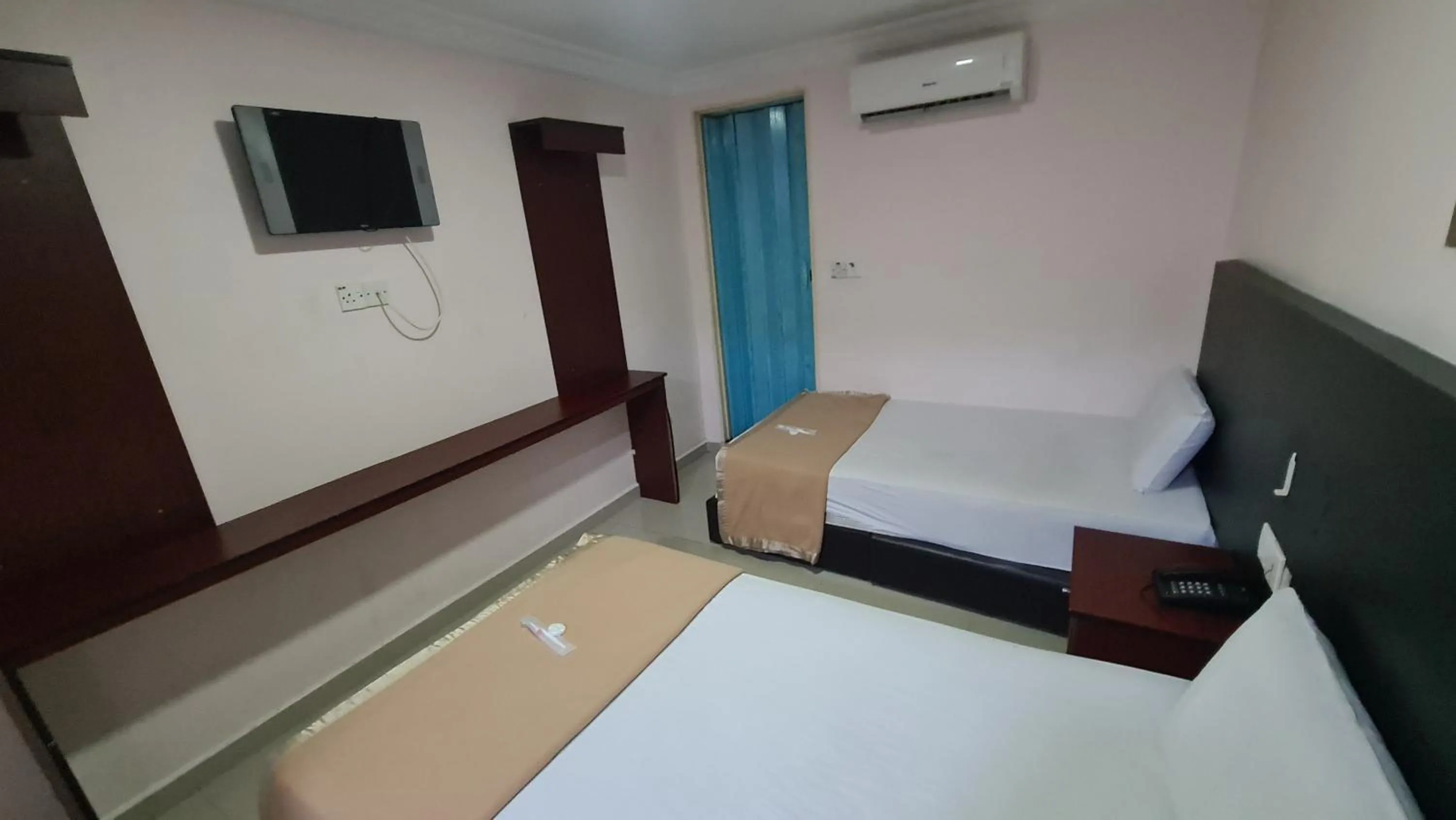 Bed in SP Venture Boutique Hotel