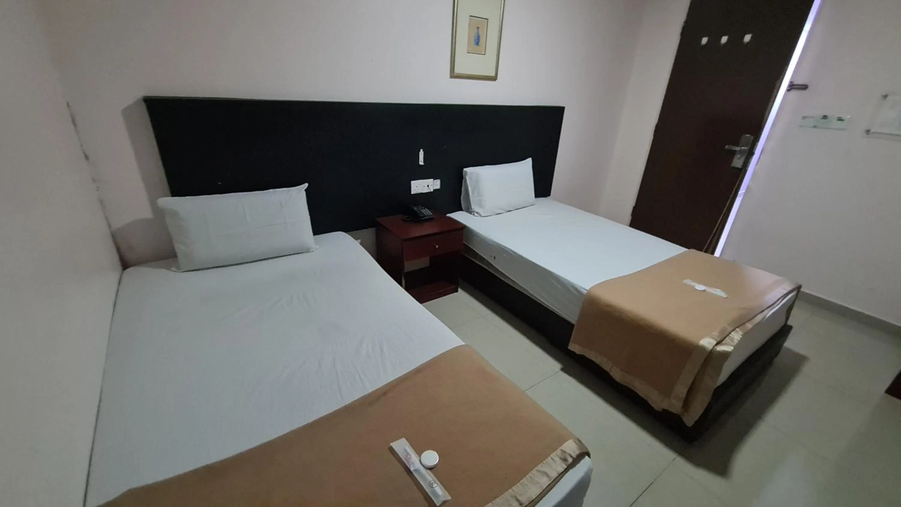 Bed in SP Venture Boutique Hotel