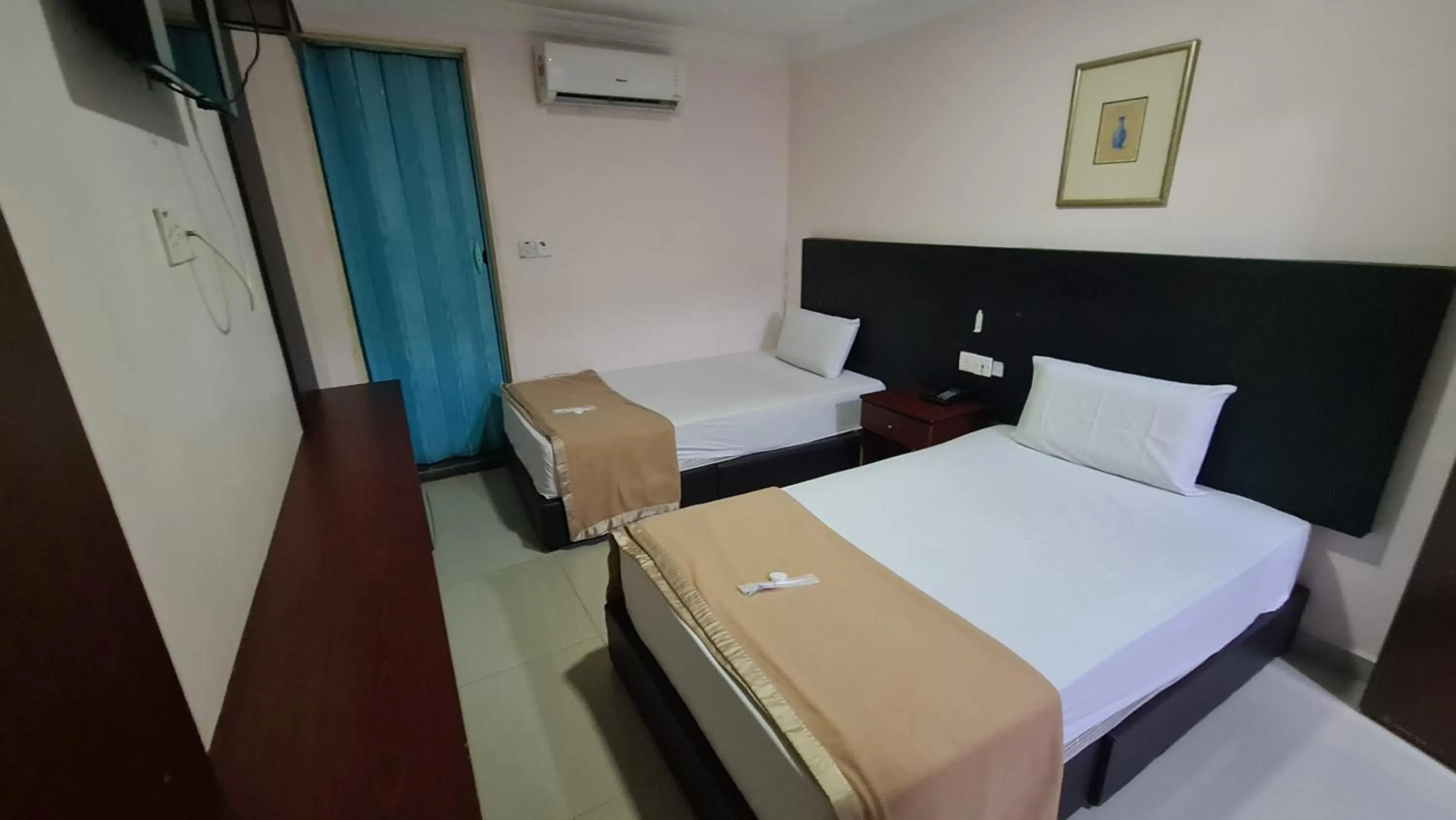 Bed in SP Venture Boutique Hotel