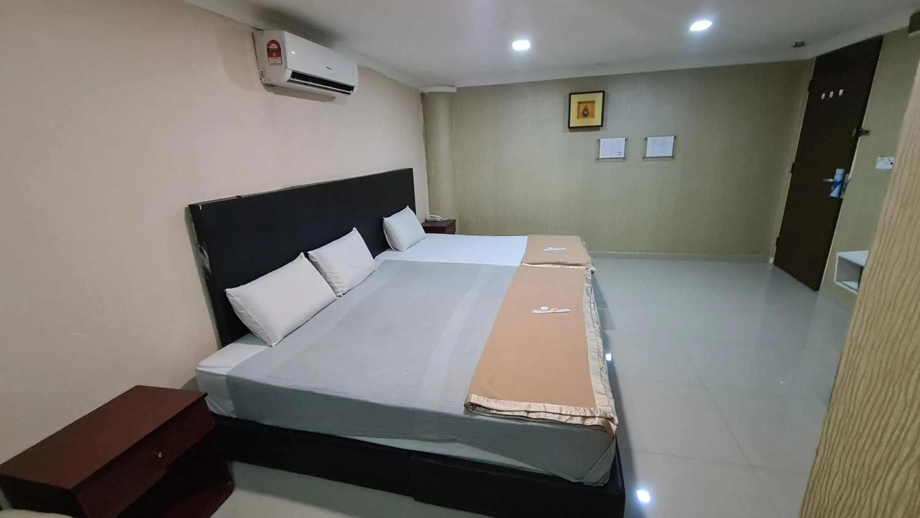 Bed in SP Venture Boutique Hotel