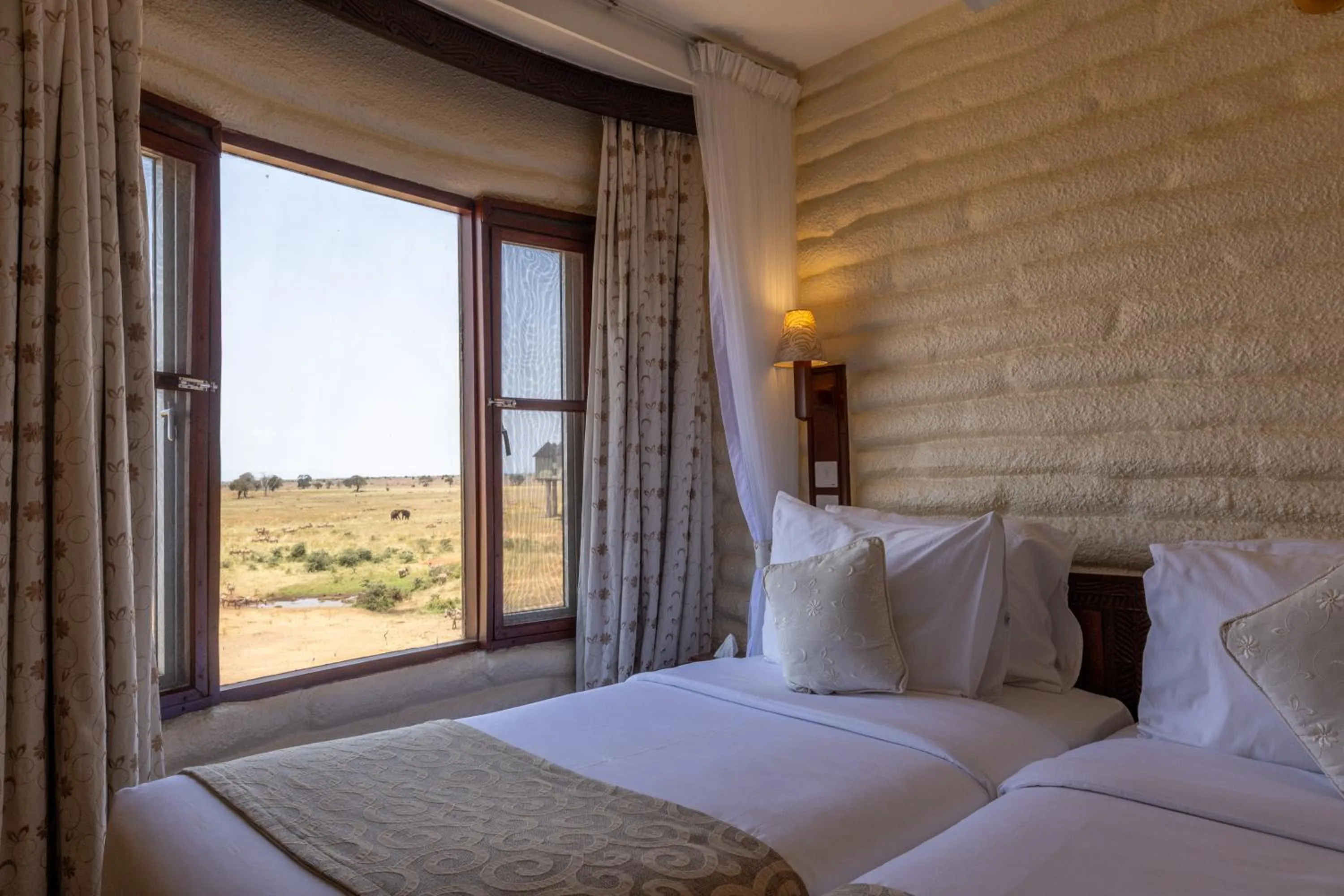 Bed in Salt Lick Safari Lodge