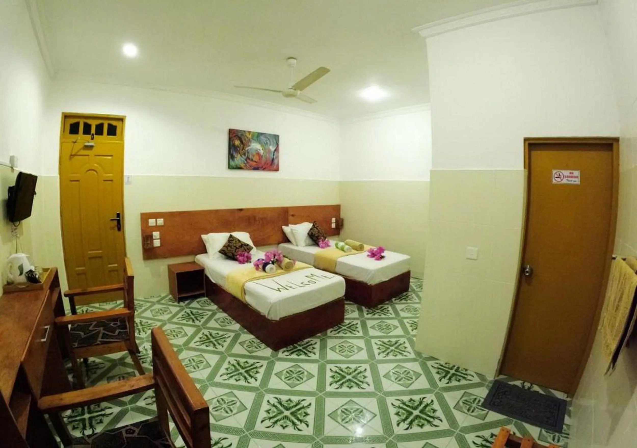 Bed in Adroit Beach Inn