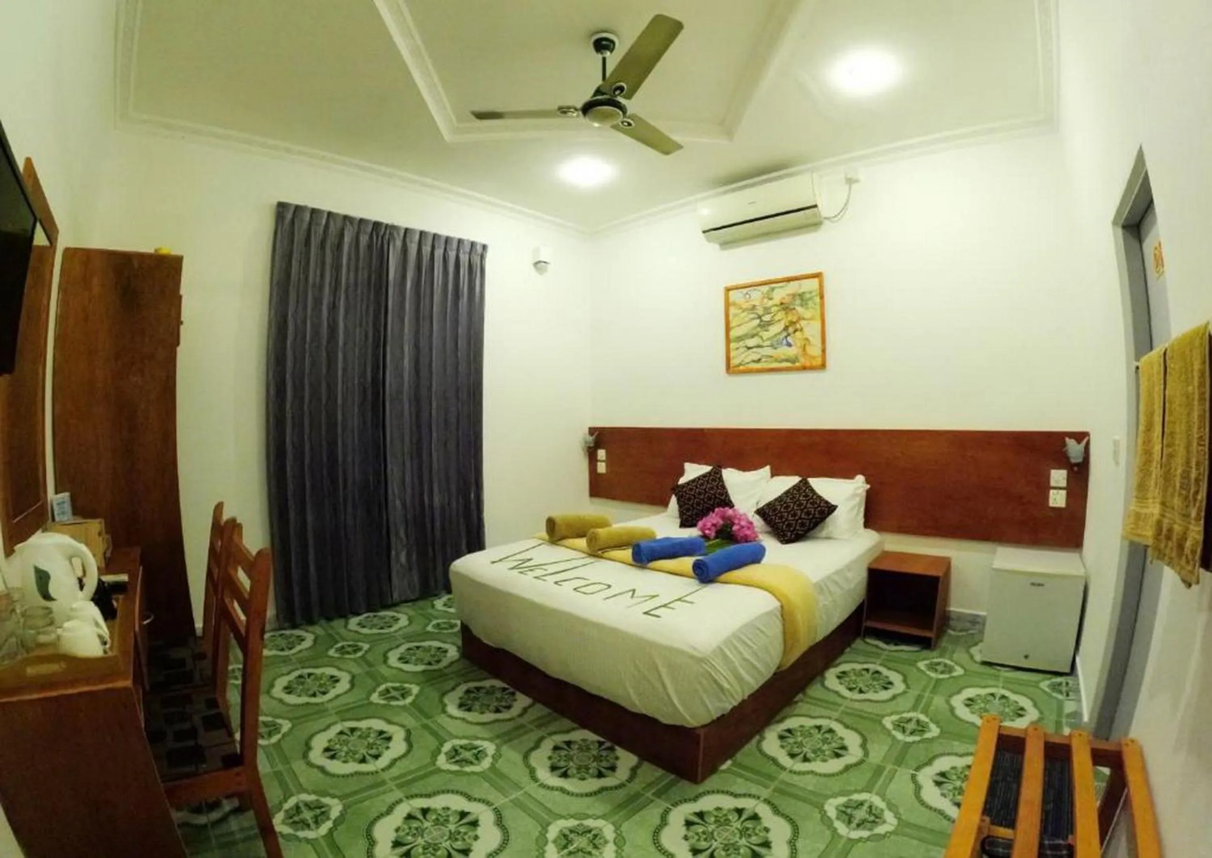 Bed in Adroit Beach Inn