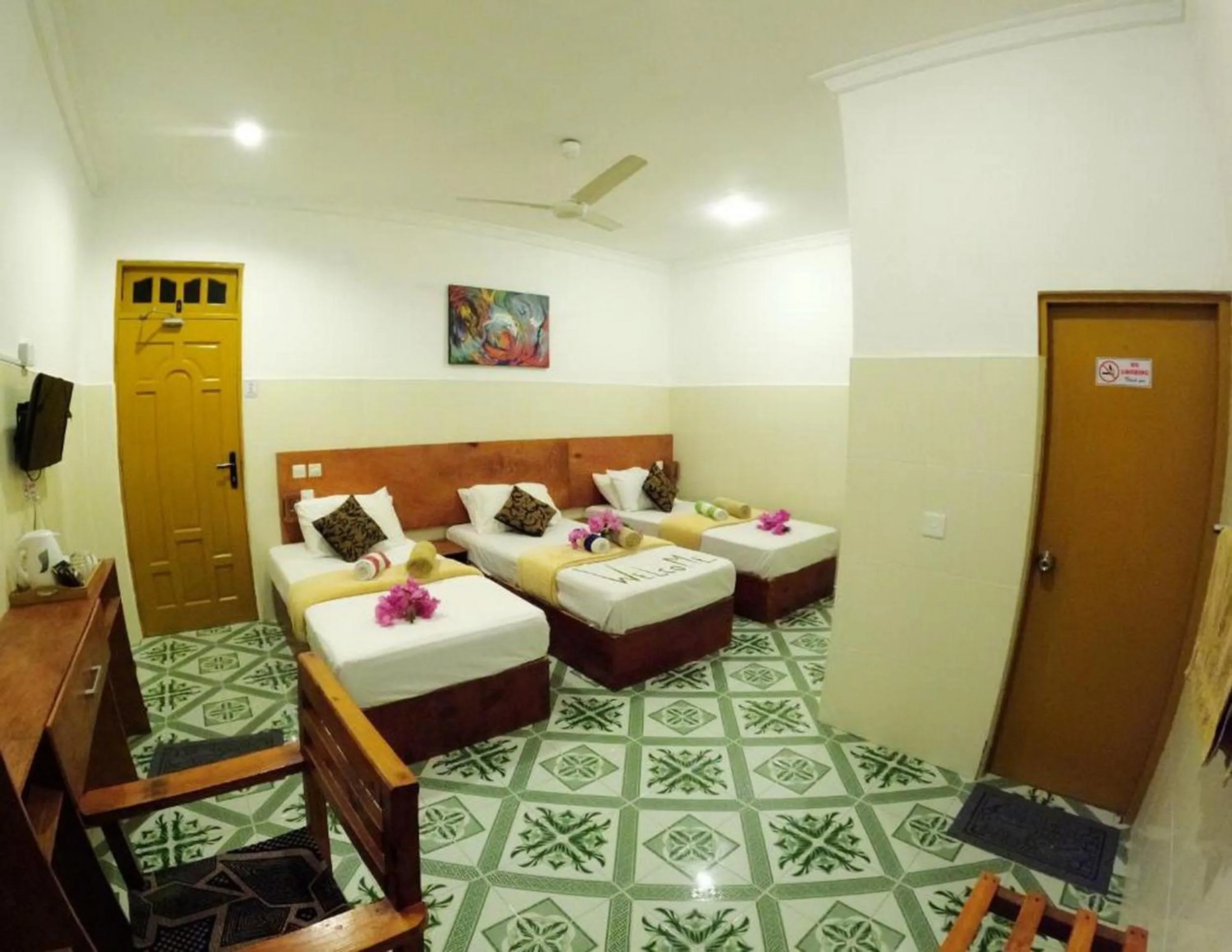 Bed in Adroit Beach Inn