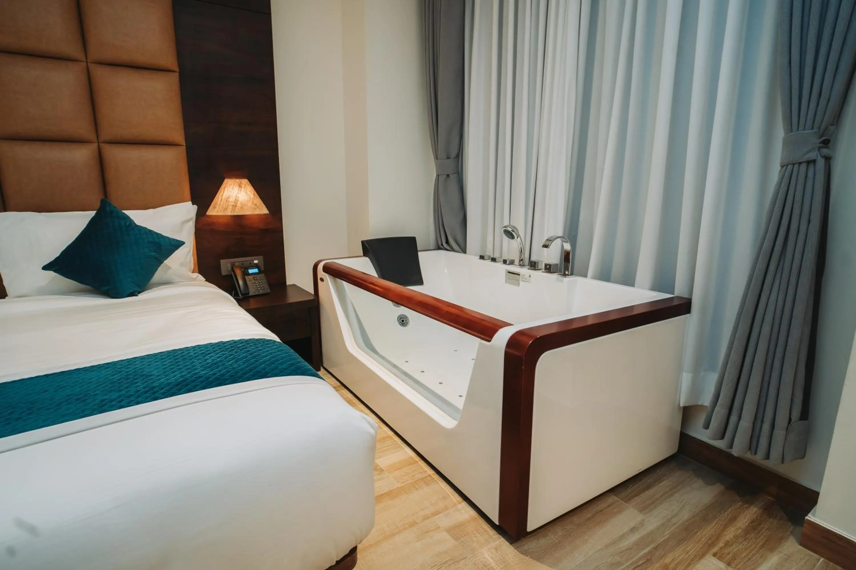 Bed in Dees Boutique Hotel