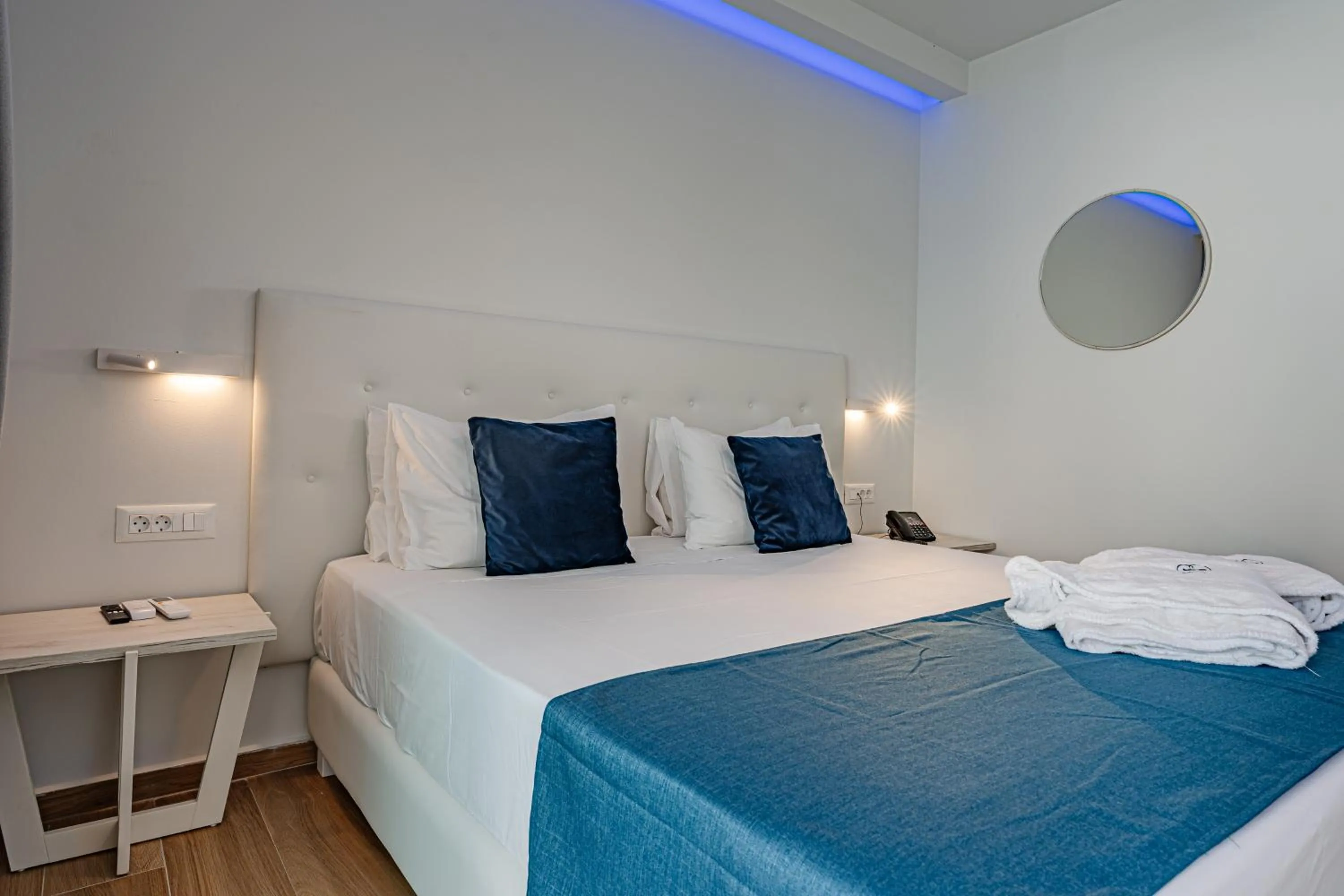 Bed in Magique Bleu Suites