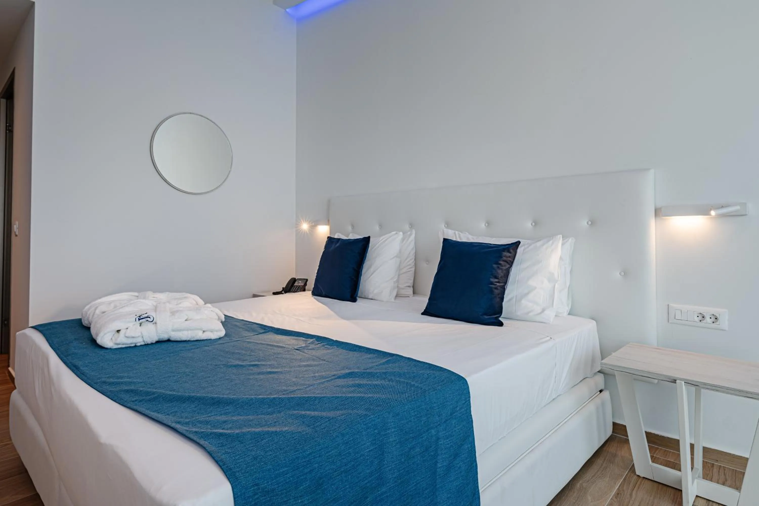 Bed in Magique Bleu Suites