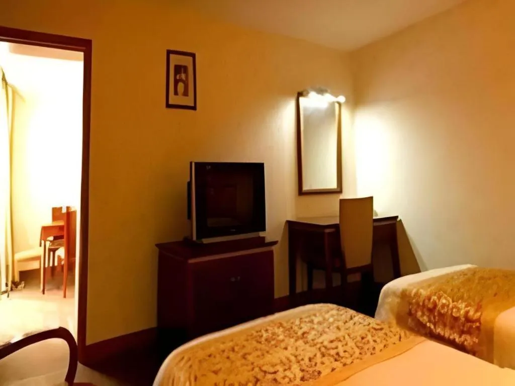 Bed in Nantong GuoDu Hotel