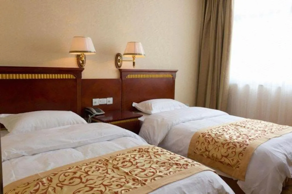 Bed in Nantong GuoDu Hotel