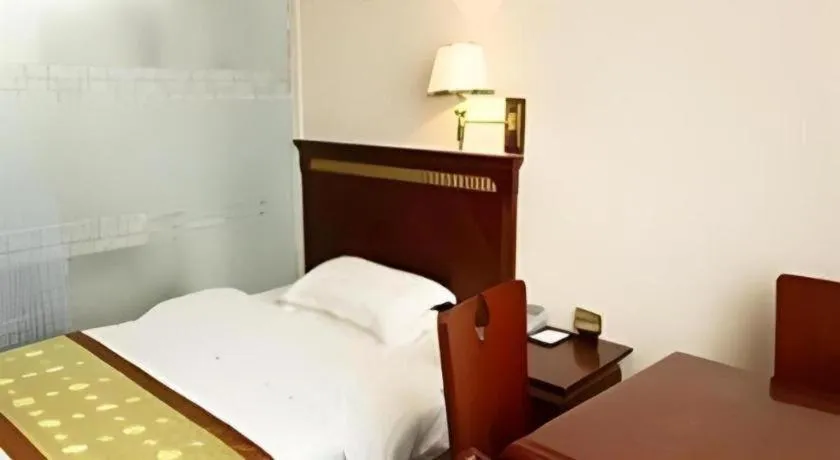 Bed in Nantong GuoDu Hotel