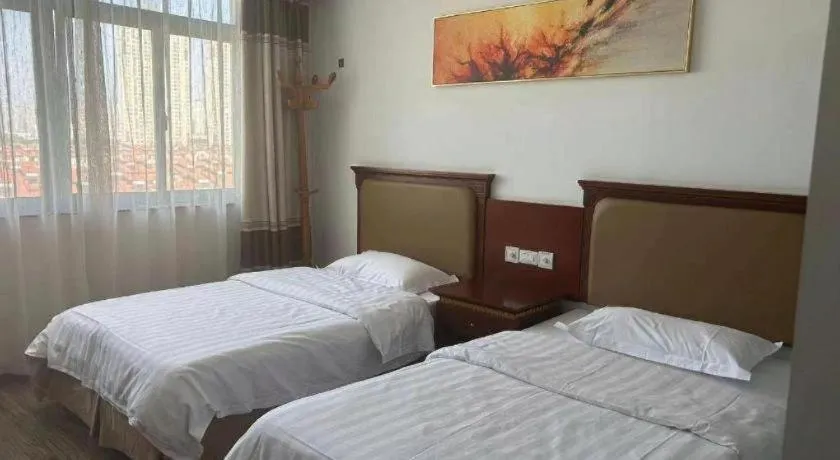 Bed in Nantong GuoDu Hotel