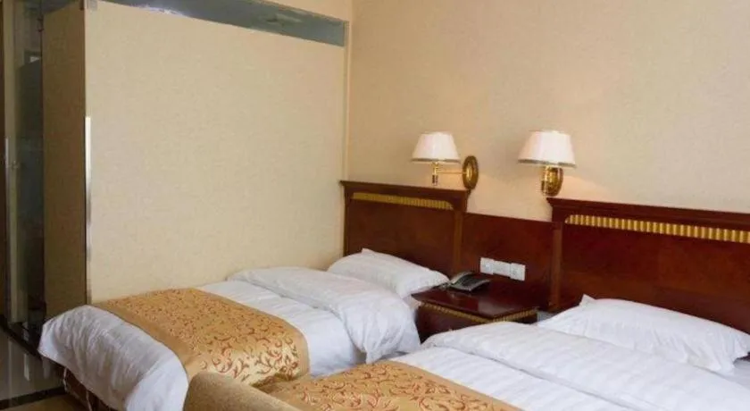 Bed in Nantong GuoDu Hotel