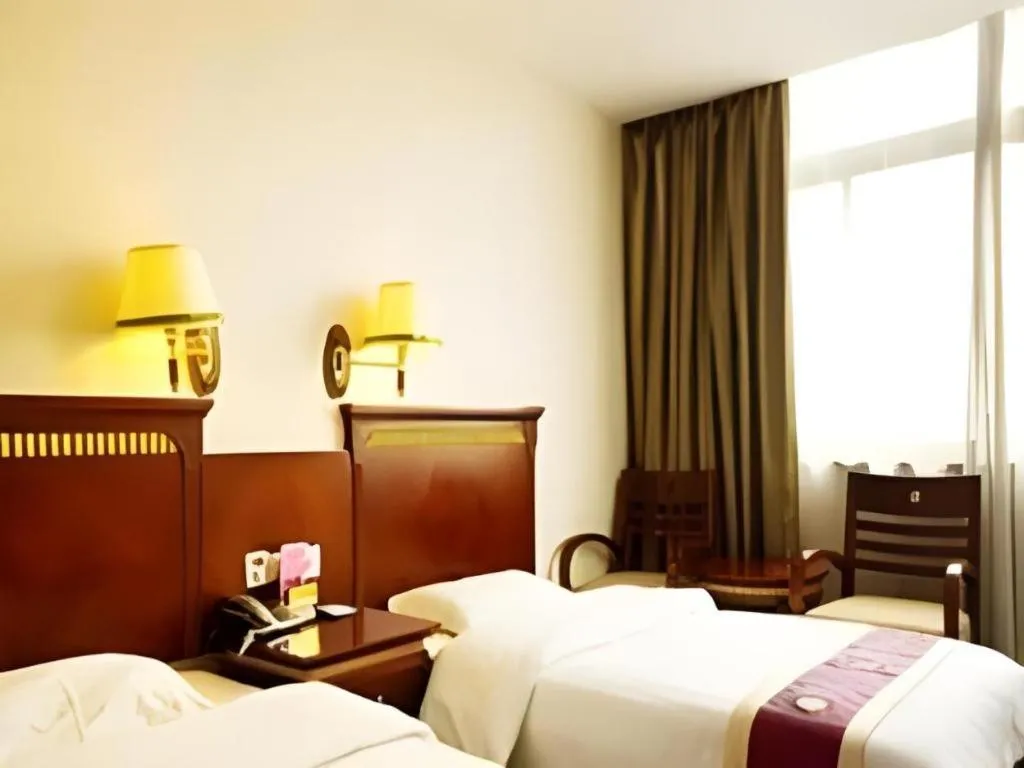 Bed in Nantong GuoDu Hotel