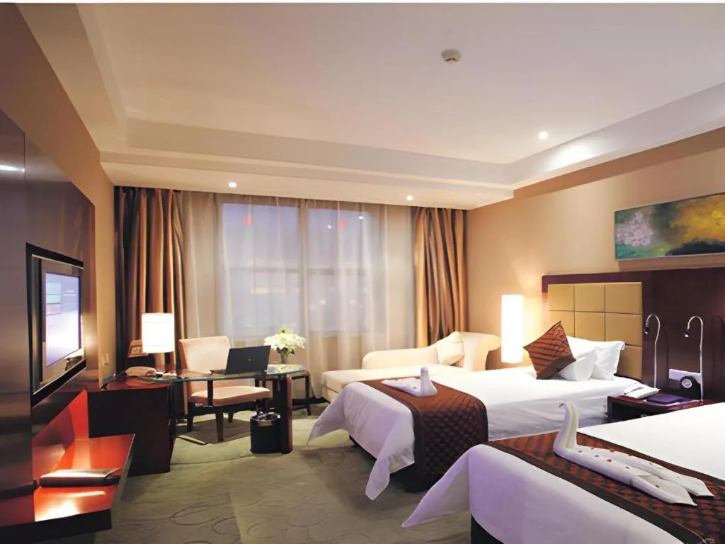 Bed in Zhongzhou International Hotel