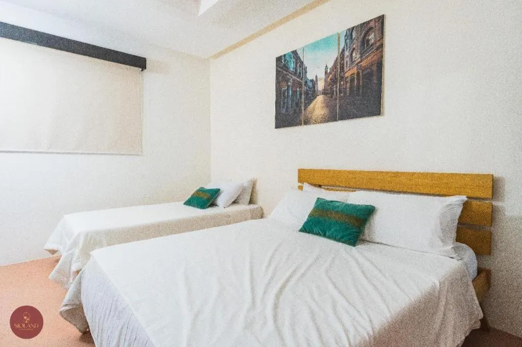 Bed in Quezon Premier Hotel - Candelaria