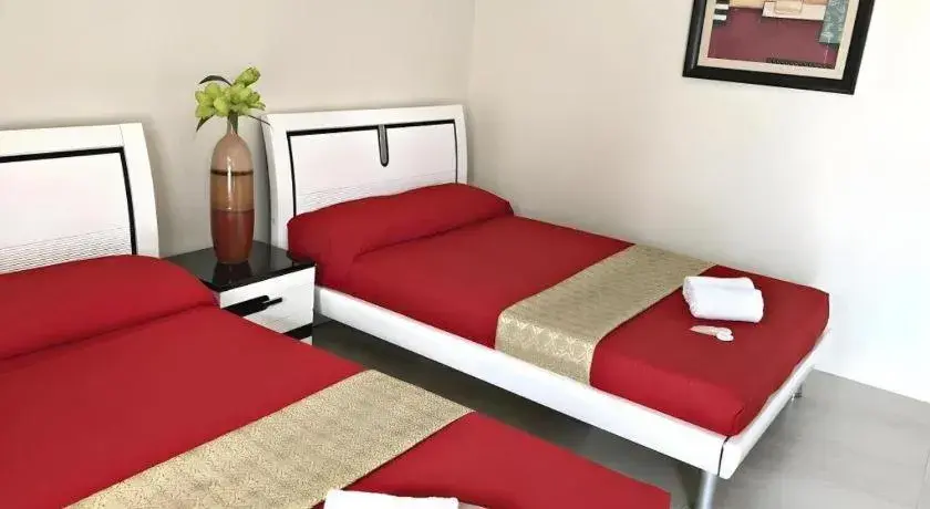 Bed in Quezon Premier Hotel - Candelaria Bed in Quezon Premier Hotel - Candelaria