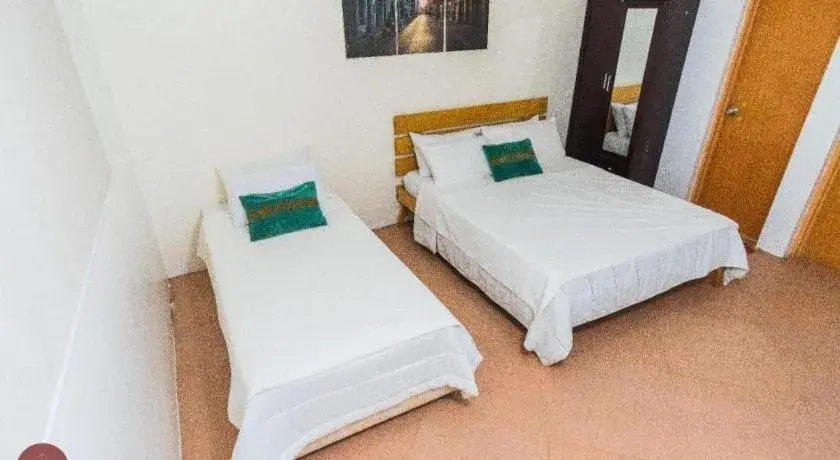 Bed in Quezon Premier Hotel - Candelaria Bed in Quezon Premier Hotel - Candelaria