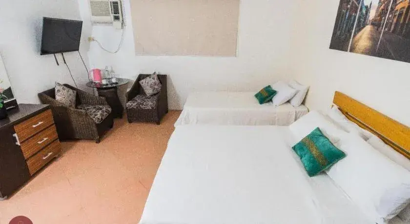 Bed in Quezon Premier Hotel - Candelaria Bed in Quezon Premier Hotel - Candelaria