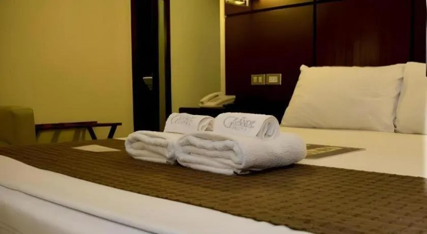 Bed in The Grande Suites