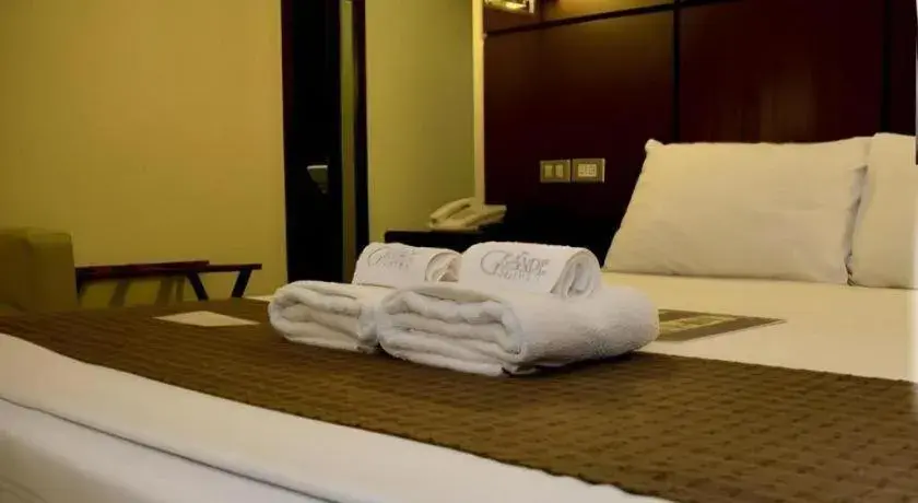 Bed in The Grande Suites Bed in The Grande Suites